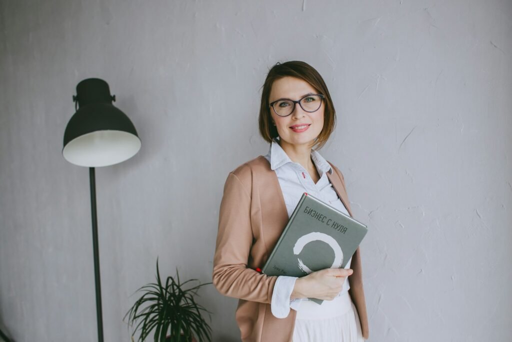 a woman holding a book in her hands