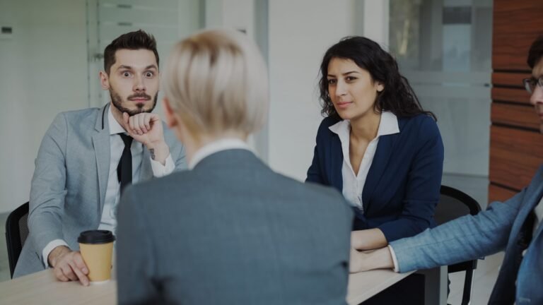 A manager and employee reviewing a career development plan together at a desk