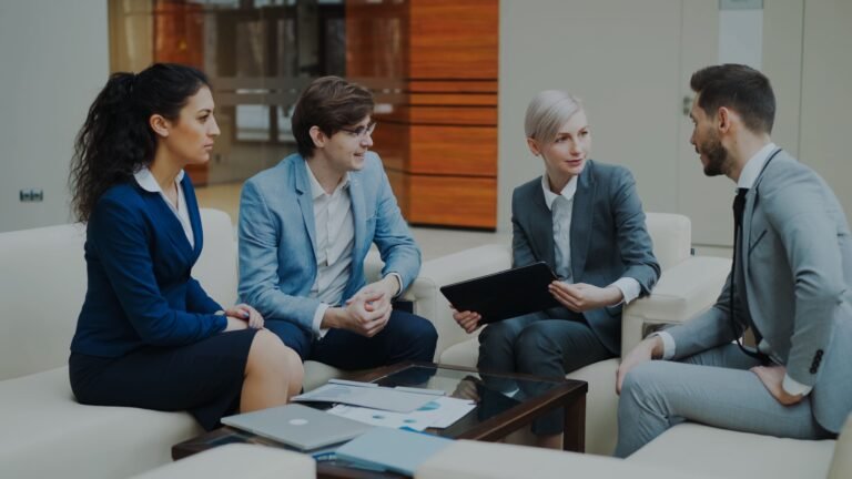 Group of professionals discussing strategy at an office.