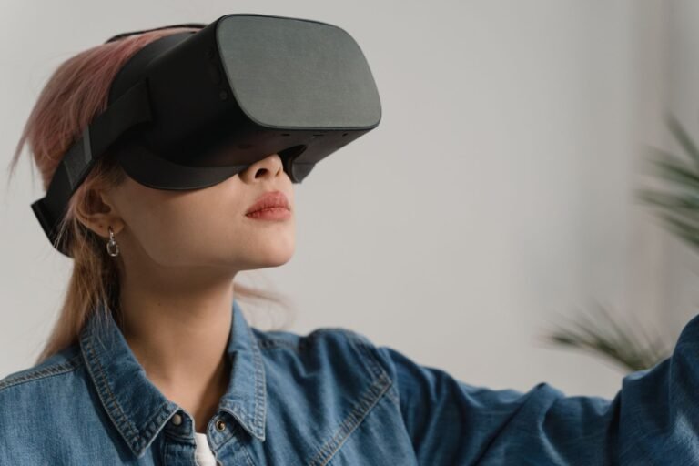 A young woman in a denim jacket enjoying virtual reality indoors, experiencing immersive technology.