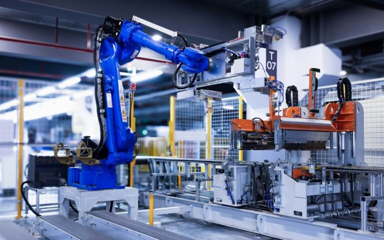 blue industrial robot arm in factory
