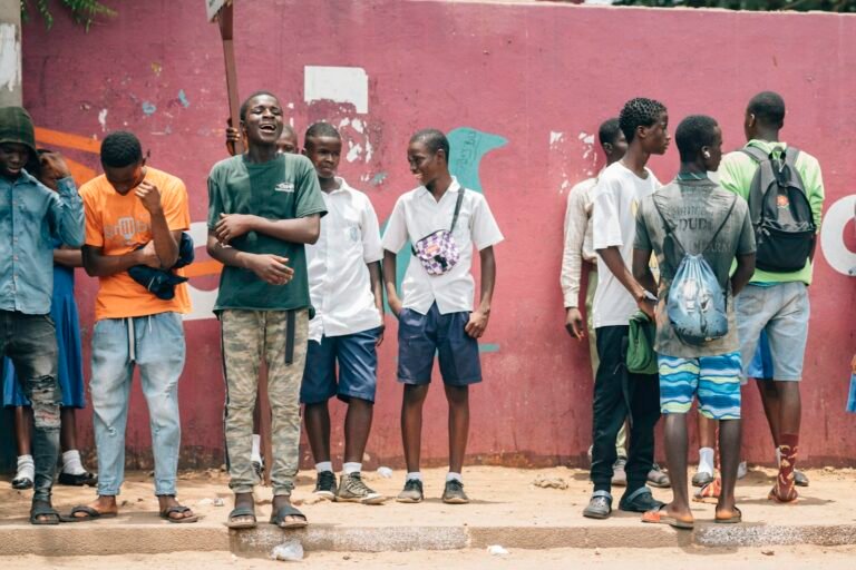 a group of young men standing next to each other
