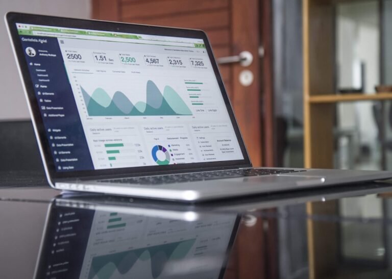 Laptop displaying financial analytics for an Islamic finance statistics guide