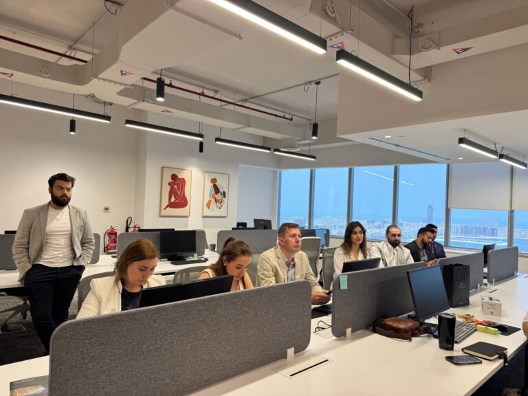Diverse team in a modern office setting focusing on a business meeting.